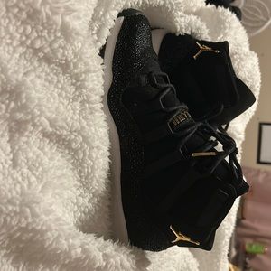 Air Jordan 11s black and gold